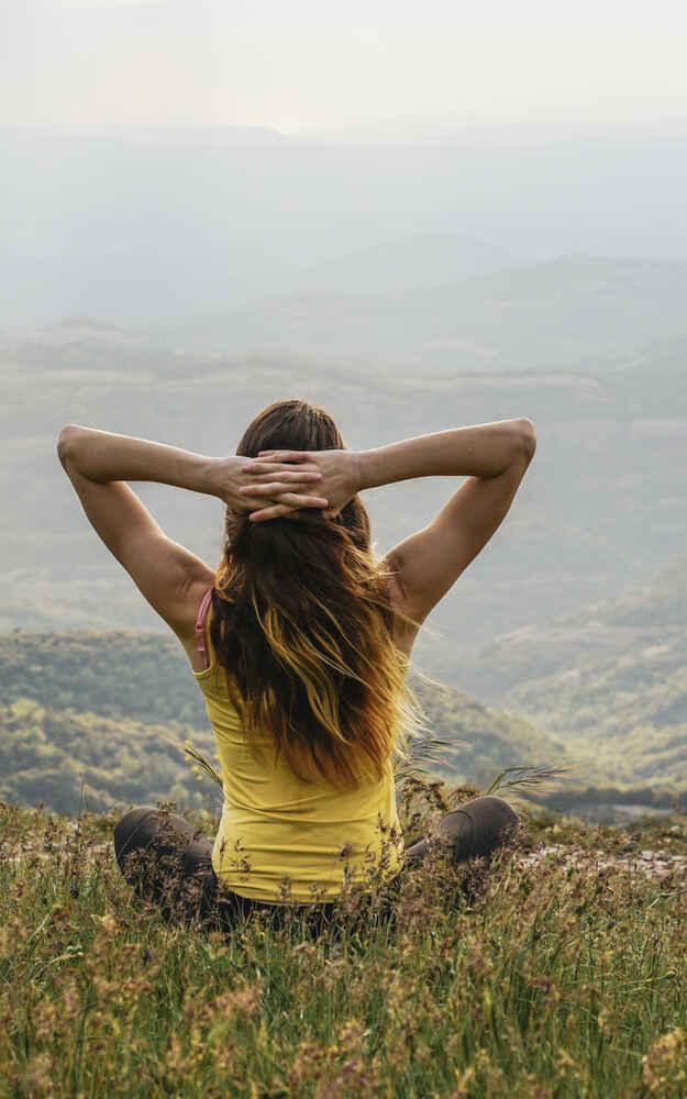 Woman enjoying the outdoor view with being free from nasal and sinus issues