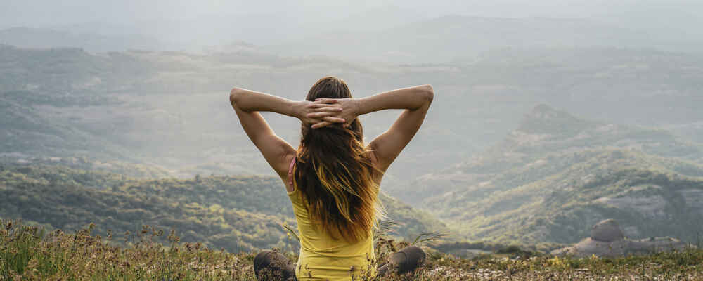 Woman enjoying the outdoor view with being free from nasal and sinus issues